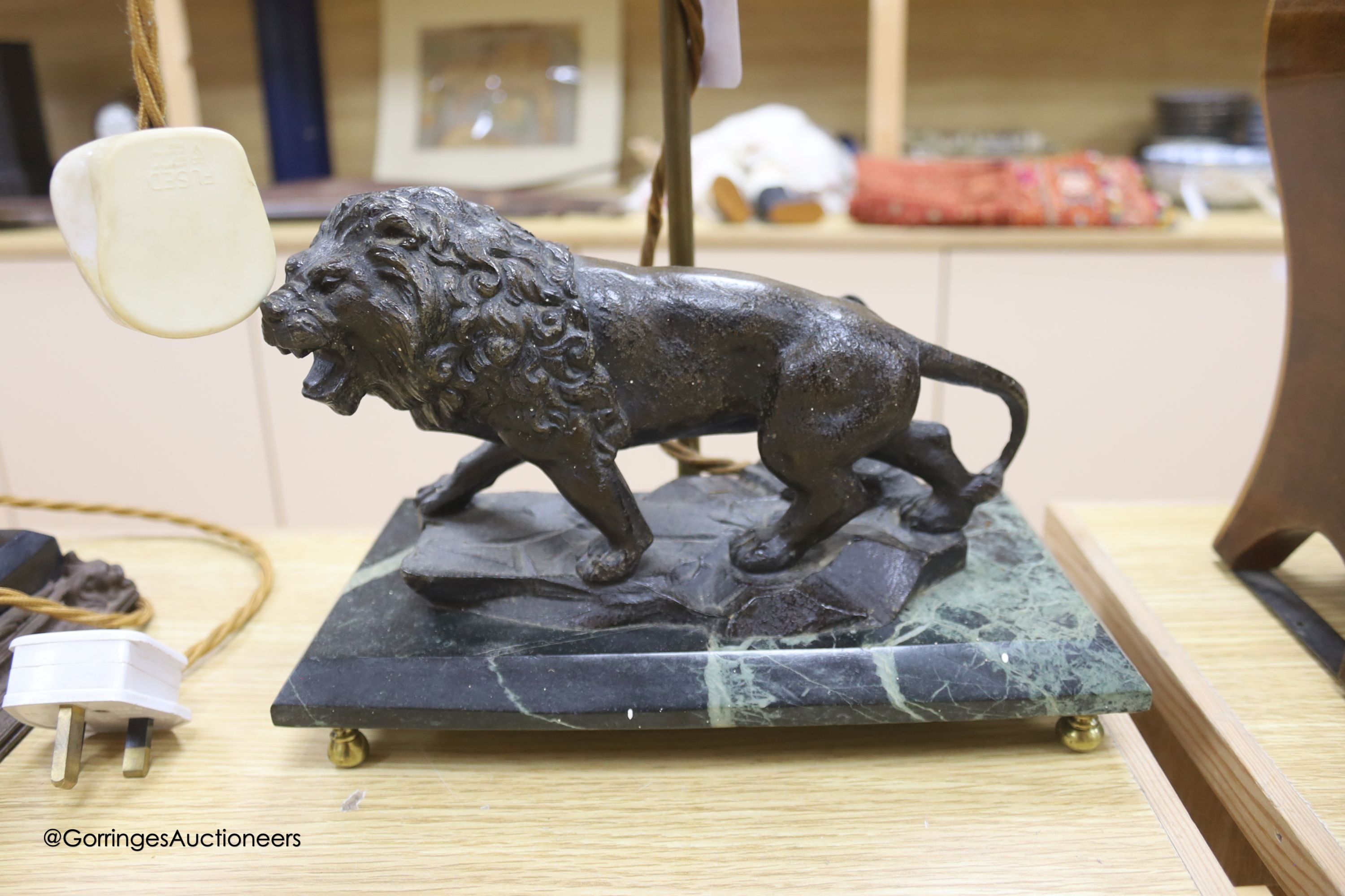 A spelter figural table lamp base and another lion student lamp, height 25cm (at base)